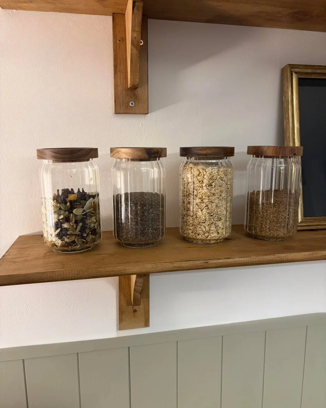 Natural textures, refined systems, and intentional organisation ✨ Rustic wooden shelves styled with clean, functional storage for a quietly luxurious kitchen.