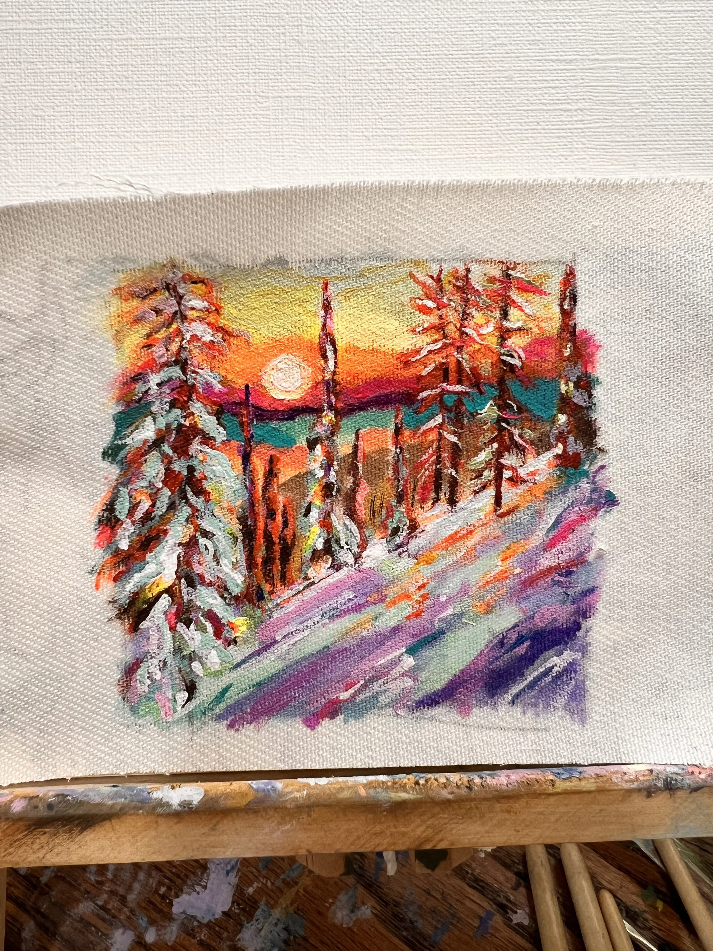 Watercolor painting of a sunset scene with pine trees on a hillside.