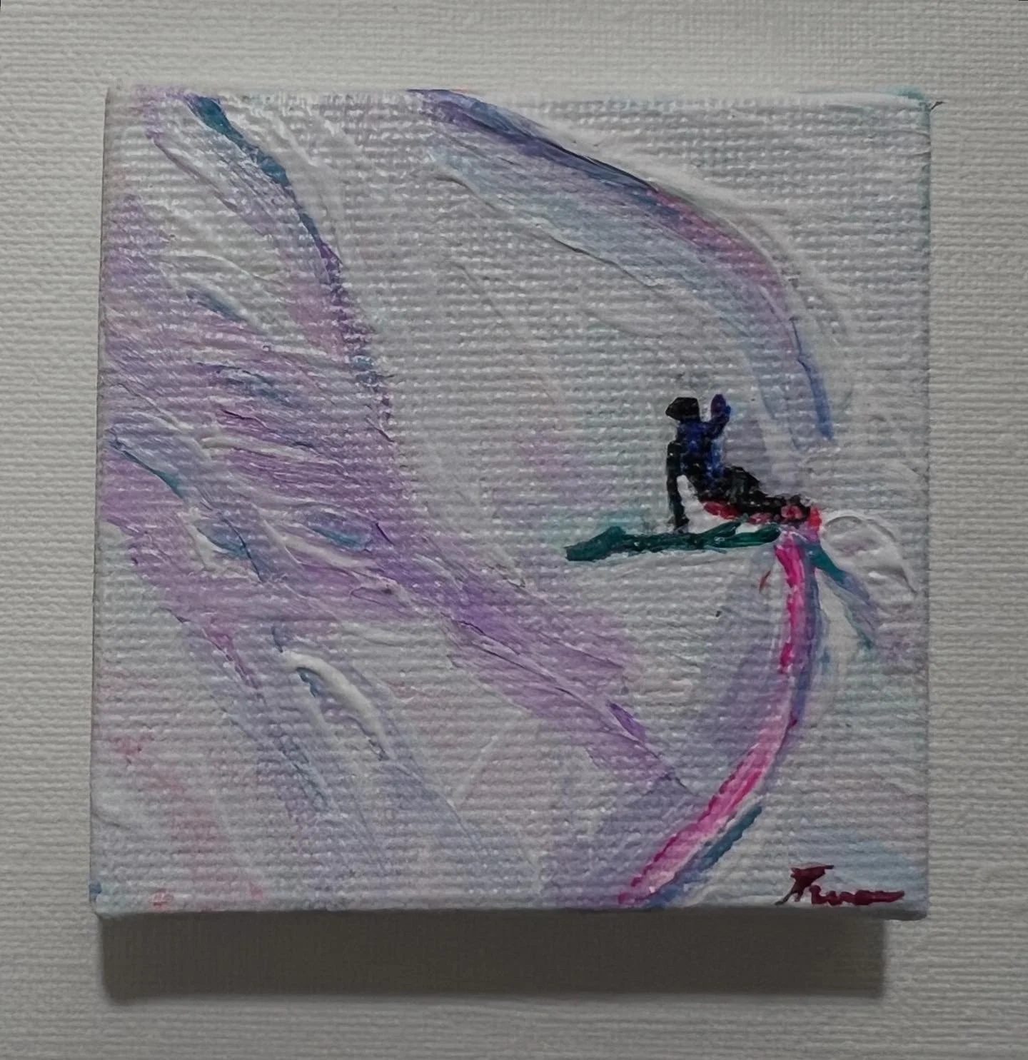 Abstract watercolor painting featuring swirling pastel colors with a small silhouette of a person riding a jet ski in the center.