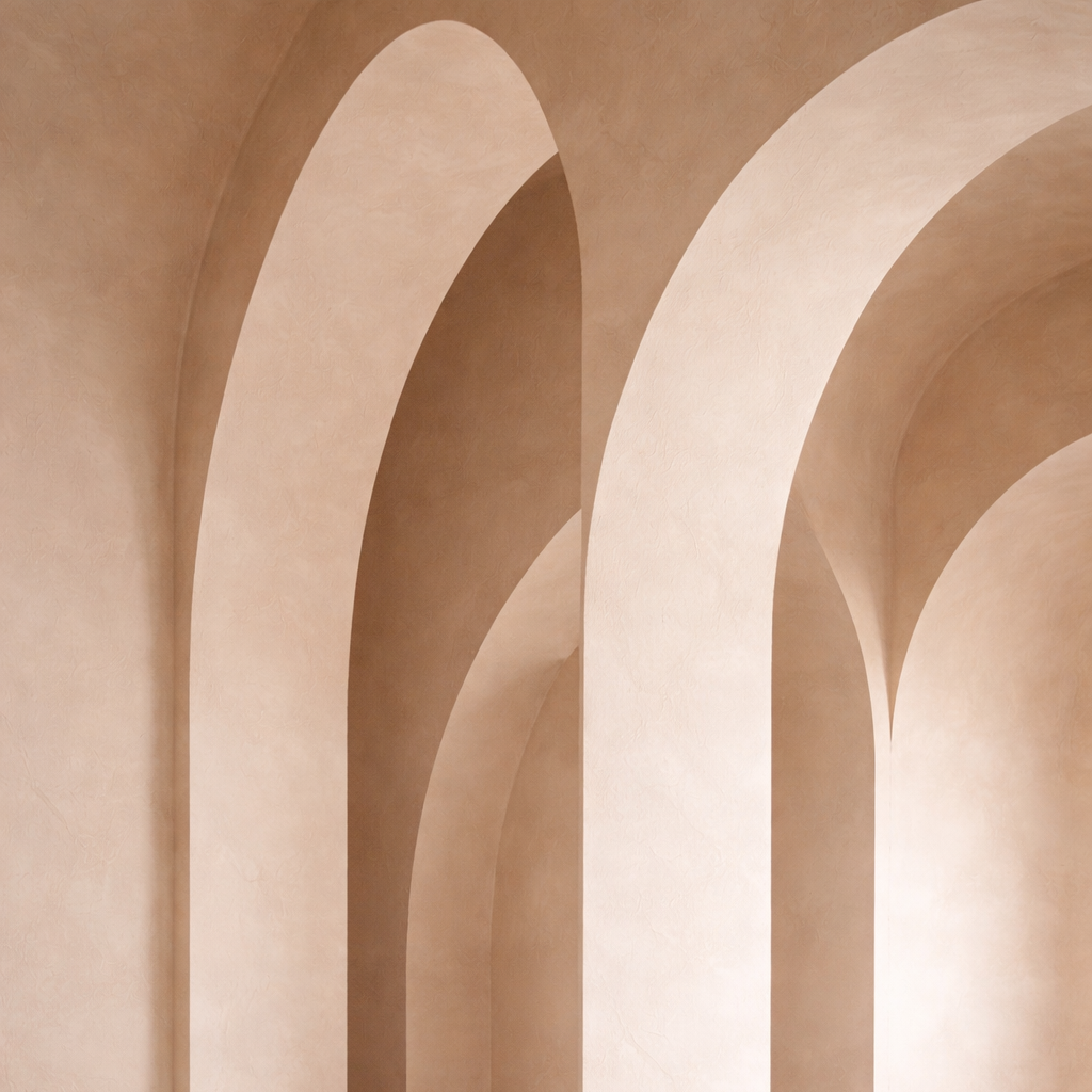Close-up of beige and light tan curved architectural arches and walls.