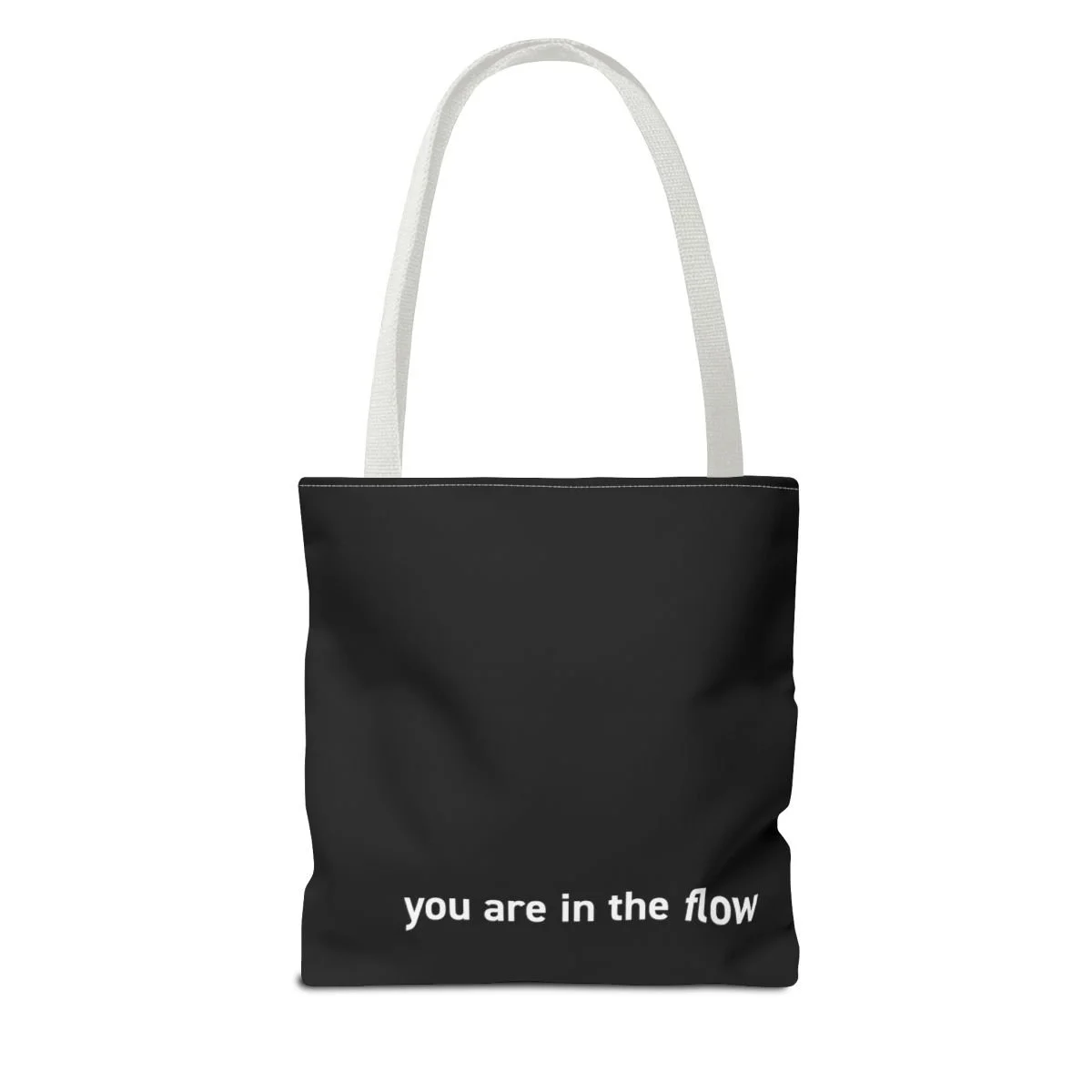 Patricia Machin Miami Portfolio Designer Art Director  Black tote bag with white straps and the phrase "you are in the flow" printed on it against a plain white background.