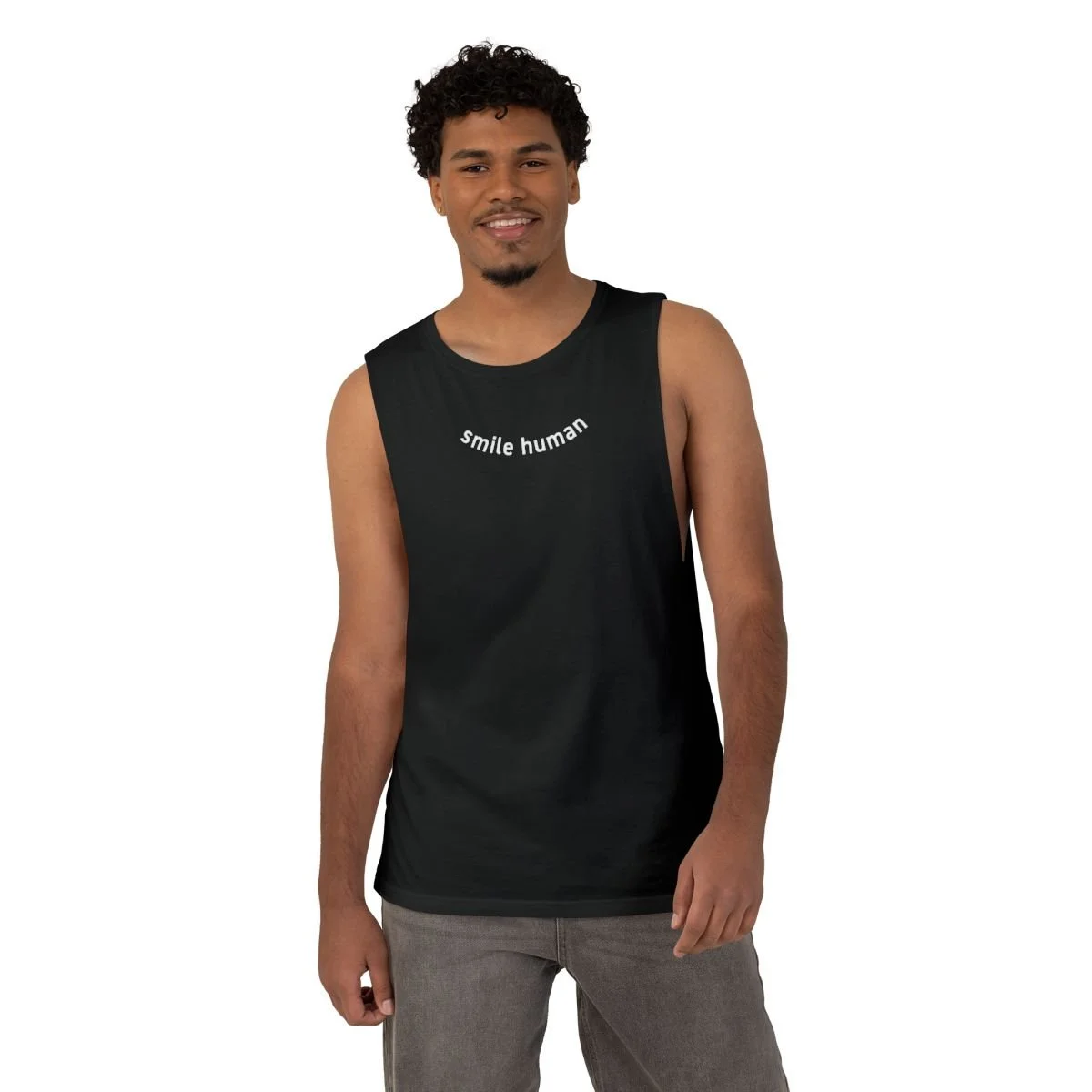 Patricia Machin Miami Portfolio Designer Art Director  A young man wearing a black tank top with the words 'smile human' written on it, posing against a plain white background.