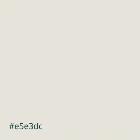 A plain curtain or fabric with a small alphanumeric code '#e5e3dc' at the bottom left corner.