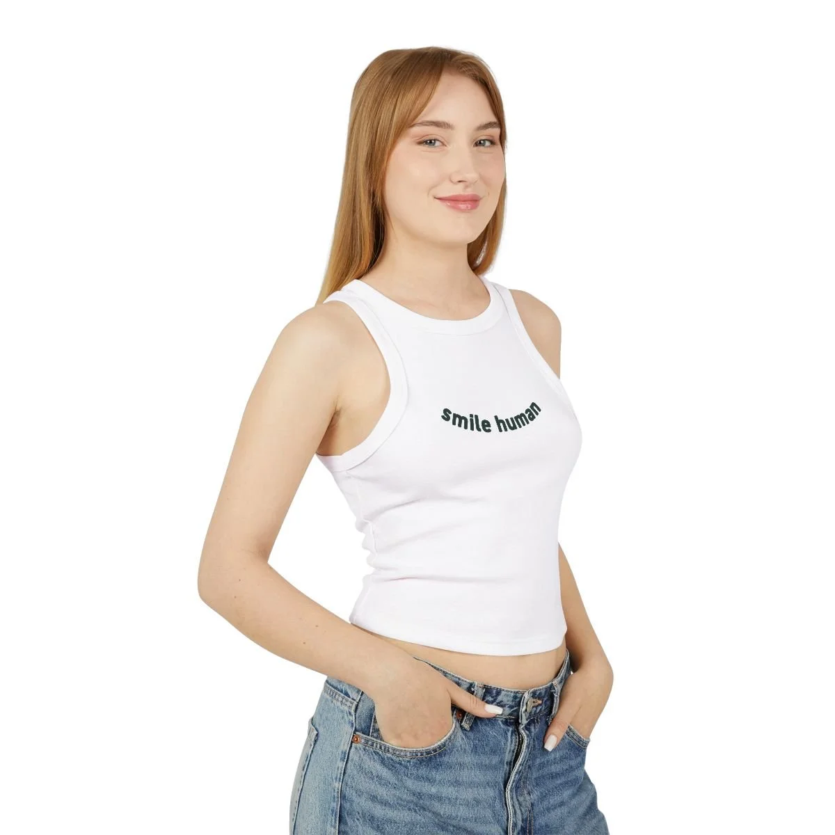 Patricia Machin Miami Portfolio Designer Art Director  A young woman with long red hair smiling, wearing a white tank top with the text 'smile human' and blue jeans, standing against a white background.