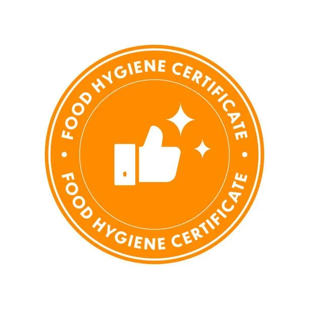 Orange circular food hygiene certificate badge with a thumbs-up icon and sparkles in the center.
