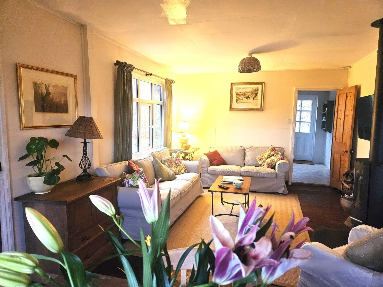 spacious snug with woodburner smart tv dining sofas wood floors