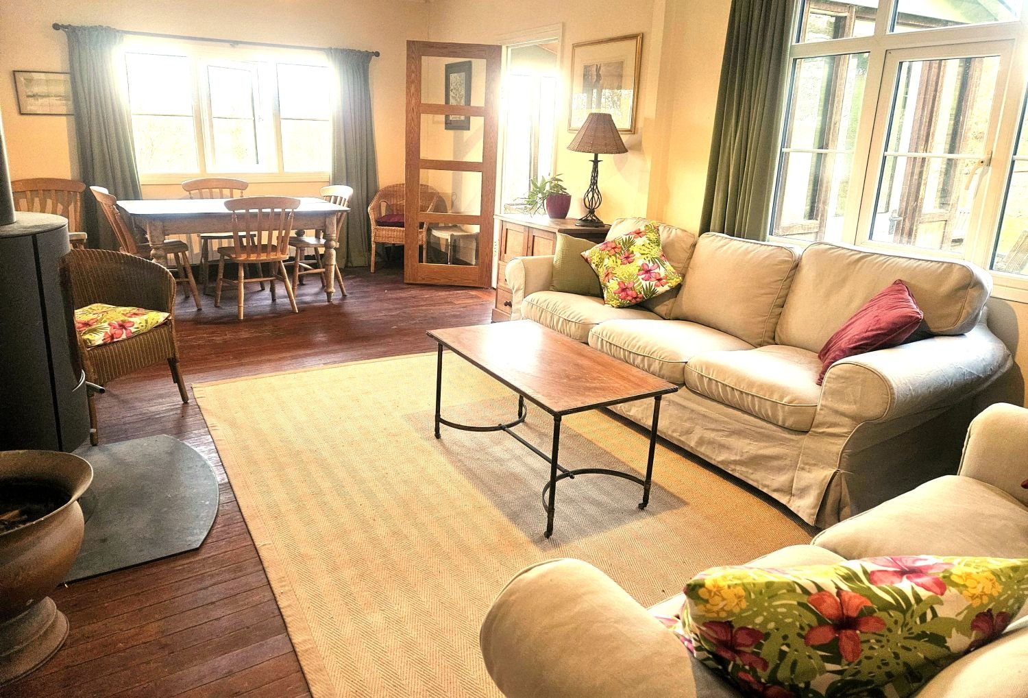 Comfortable spacious sitting room with wood burner and smart tv