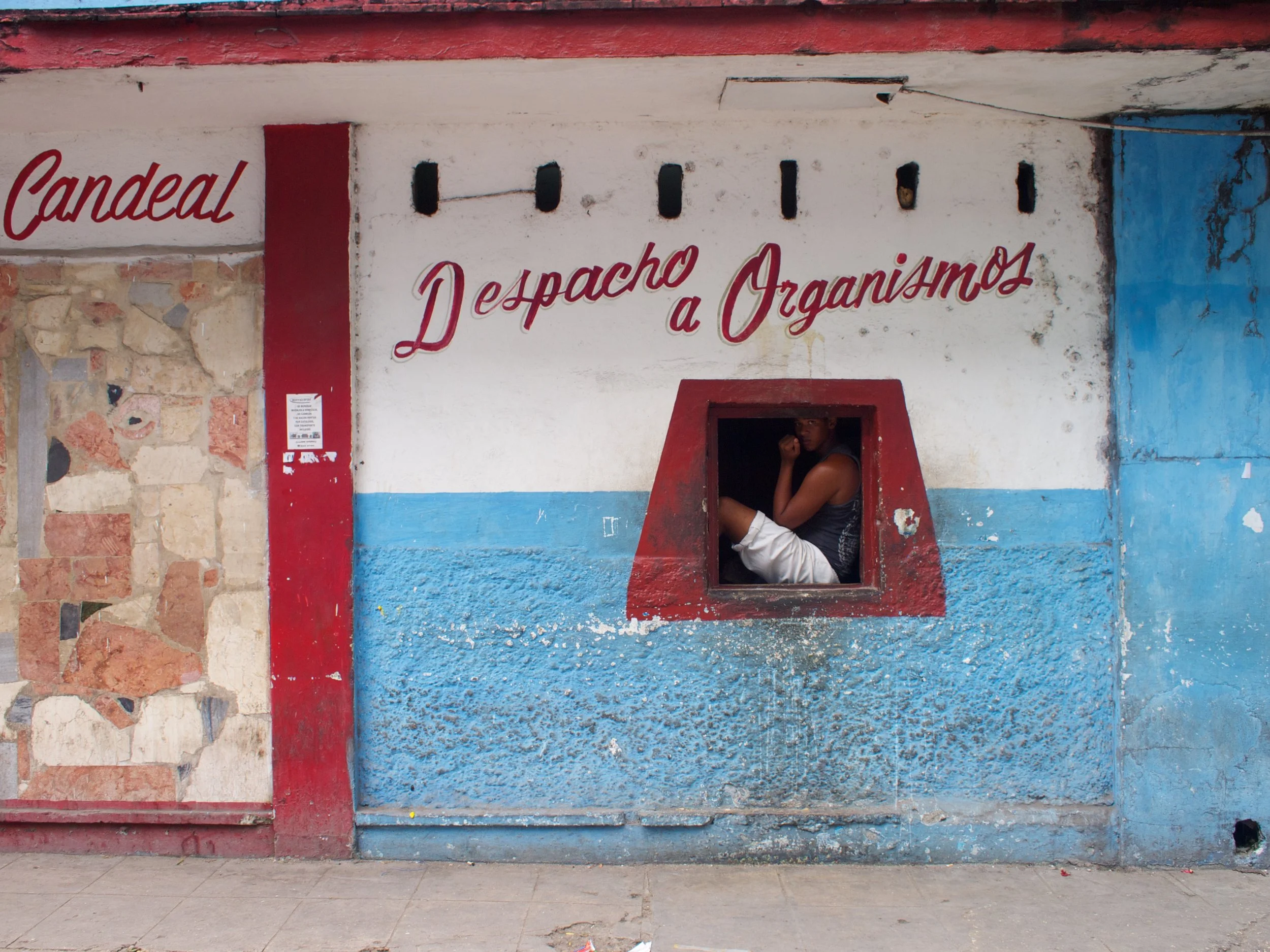 Boy in Window, Havana.jpg