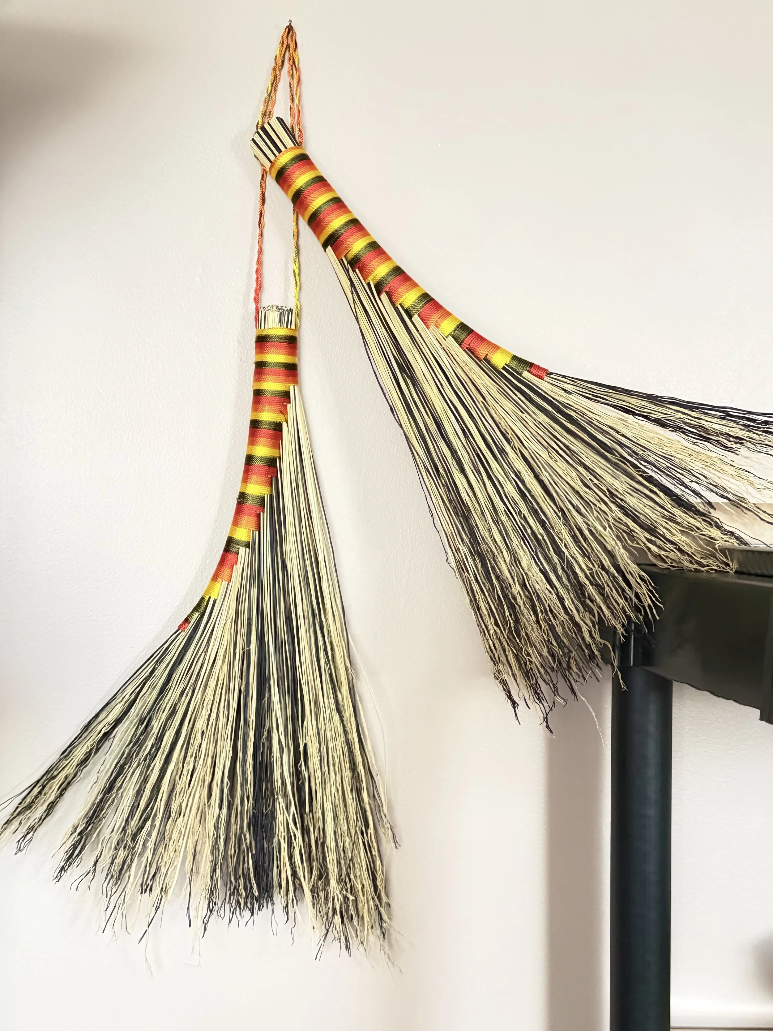 multicolored twine on black and natural colored broomcorn turkey wing