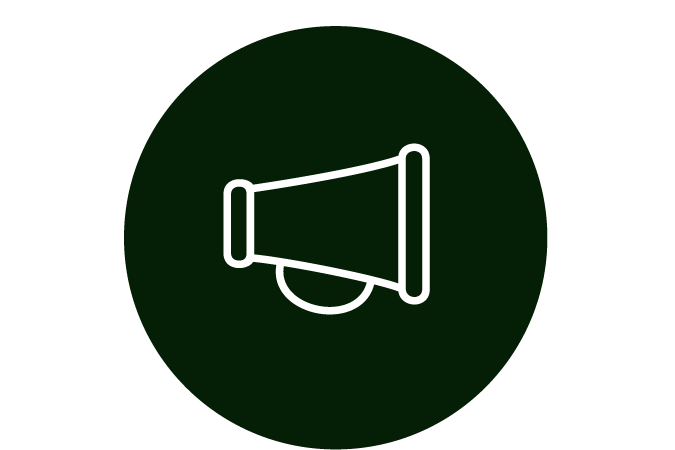 Icon of a white loudspeaker inside a dark green circle.
