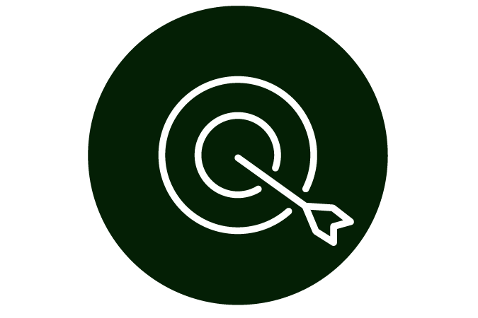 A white arrow hitting the bullseye of a spiral target on a dark green background.