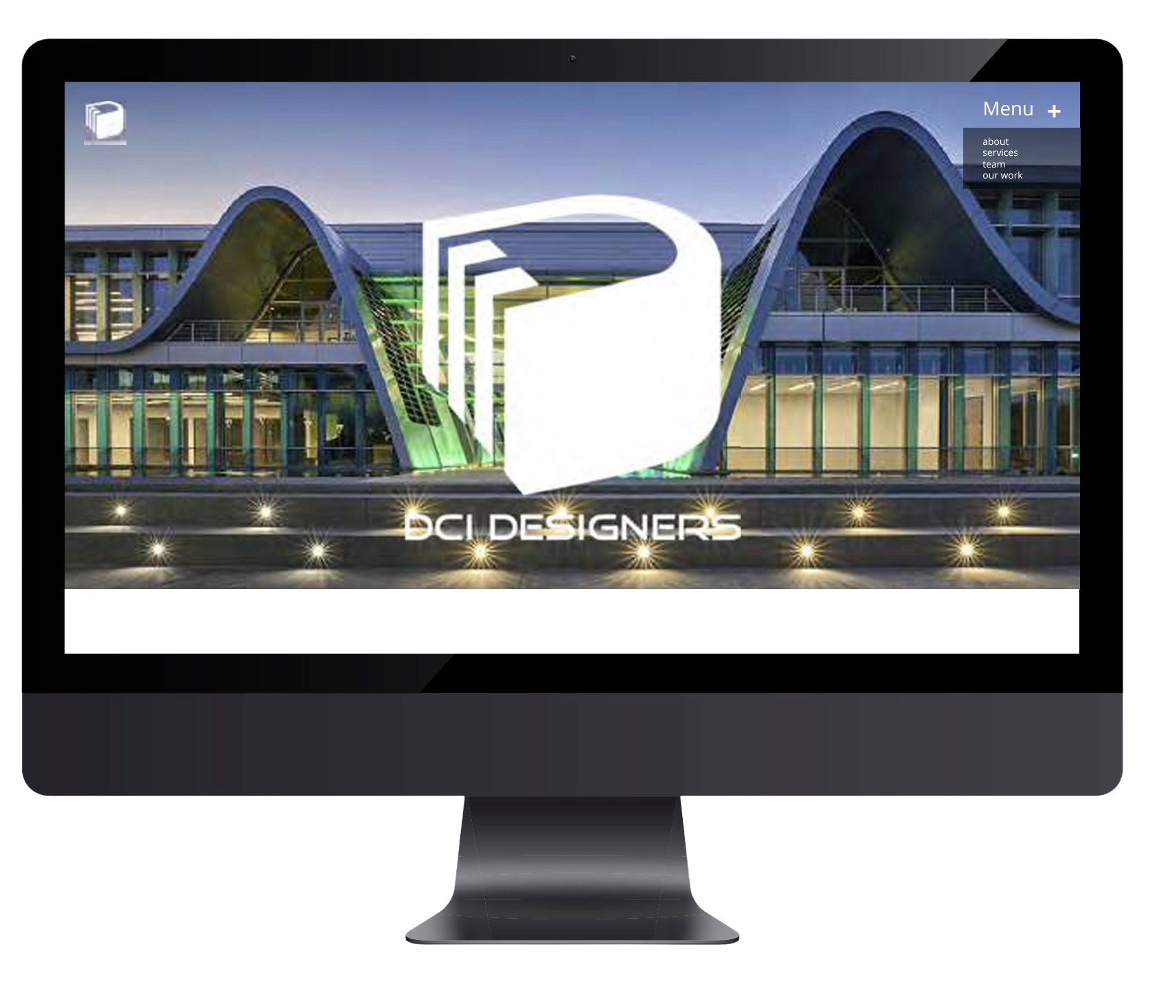 Computer monitor displaying a building with modern architecture and the logo and name 'BCI Designers' on the screen.
