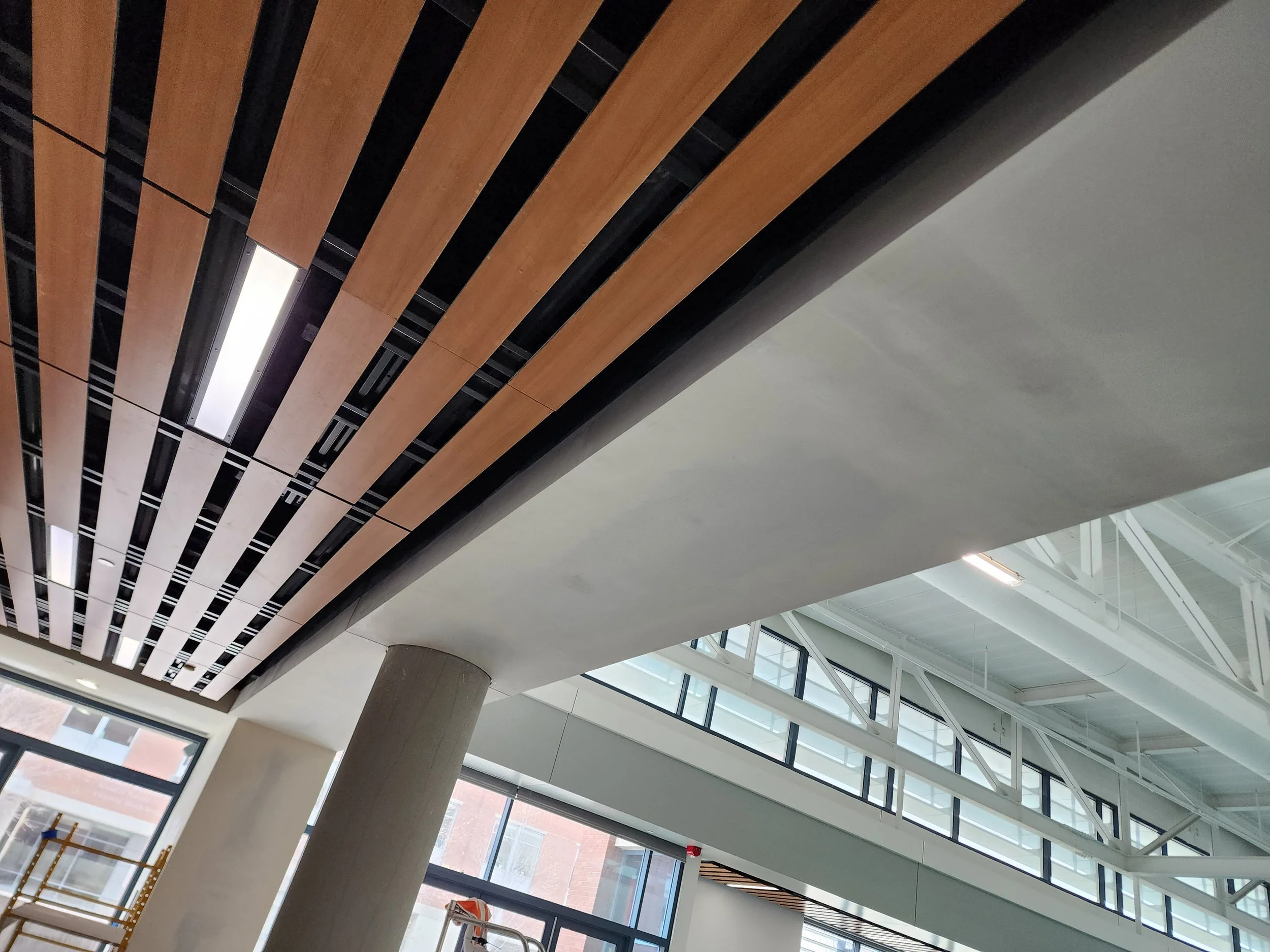 BSU renovation featuring custom ceiling design and interior finishes by Evolution Drywall & Restoration