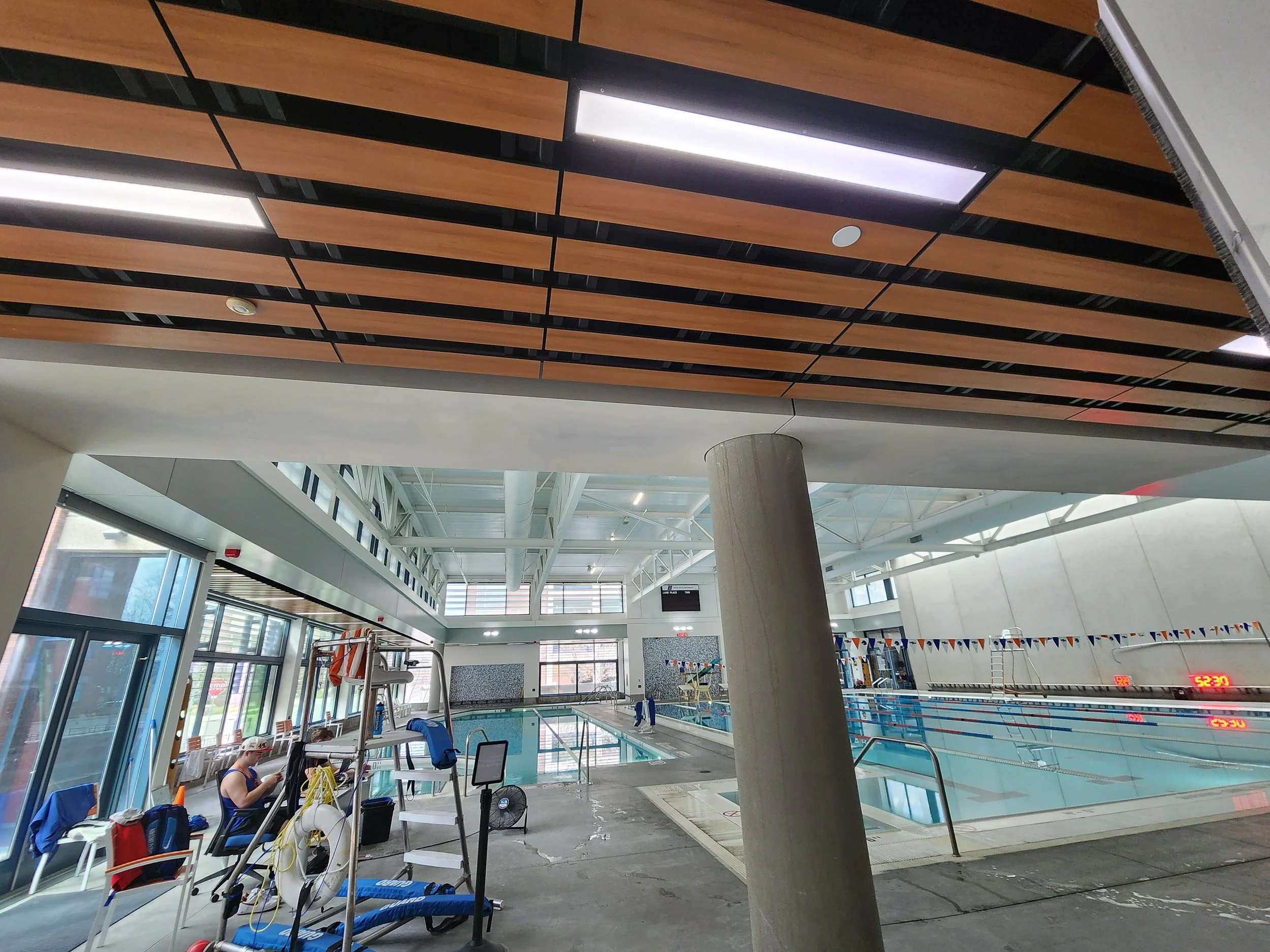 Before and after renovation of indoor pool facility including framing, drywall, and interior finishing by Evolution Drywall & Restoration