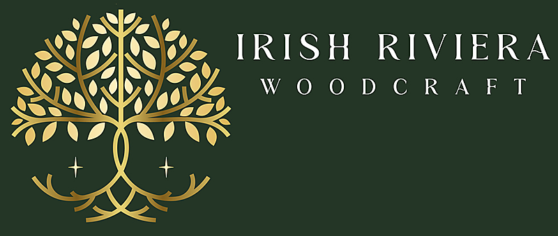 Logo for Irish Riviera Woodcraft featuring a stylized gold tree with heart-shaped leaves on a dark green background, with the text 'Irish Riviera Woodcraft' to the right.