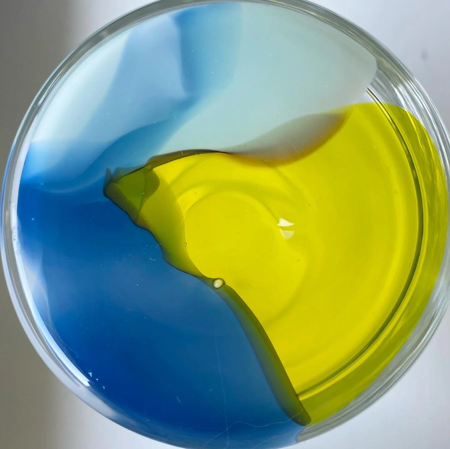 Colour POP cup detail photo of the bottom with blue and yellow  swirled together.