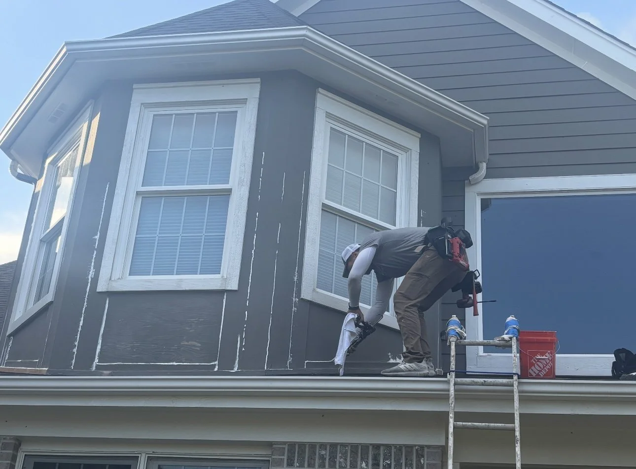 Contractor completing upper exterior and roofline work in Crystal Lake Illinois
