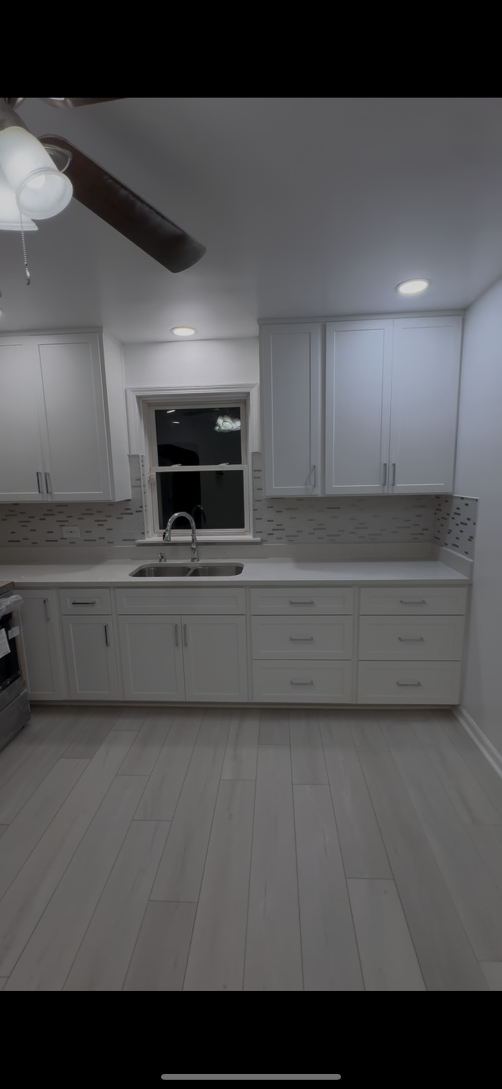 After photo of completed white cabinet kitchen remodel in Chicago Illinois