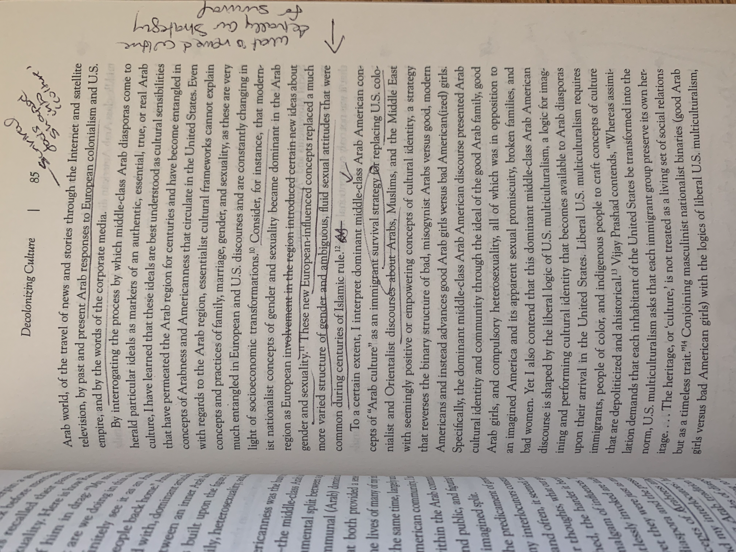 A close-up photograph of a printed book page showing dense text and handwritten notes in the margins. The notes include a short phrase with an arrow pointing to the paragraph, and some underlining and circling of text.