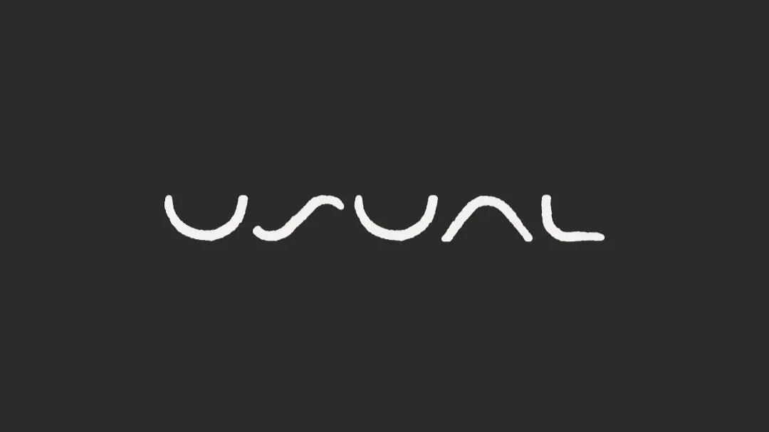 Abstract line-based logo mark for The Usual on a dark background.