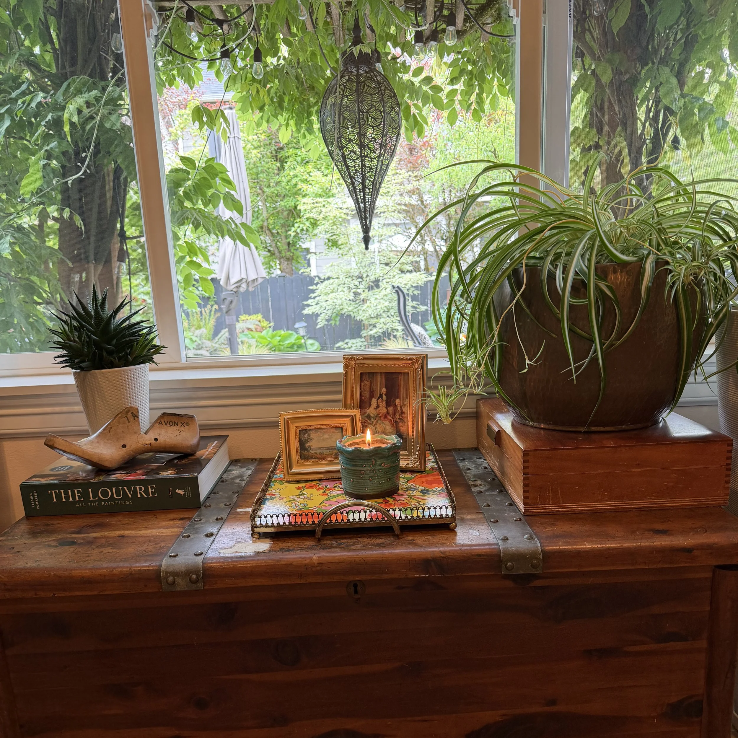Curated keepsakes topped an antique trunk