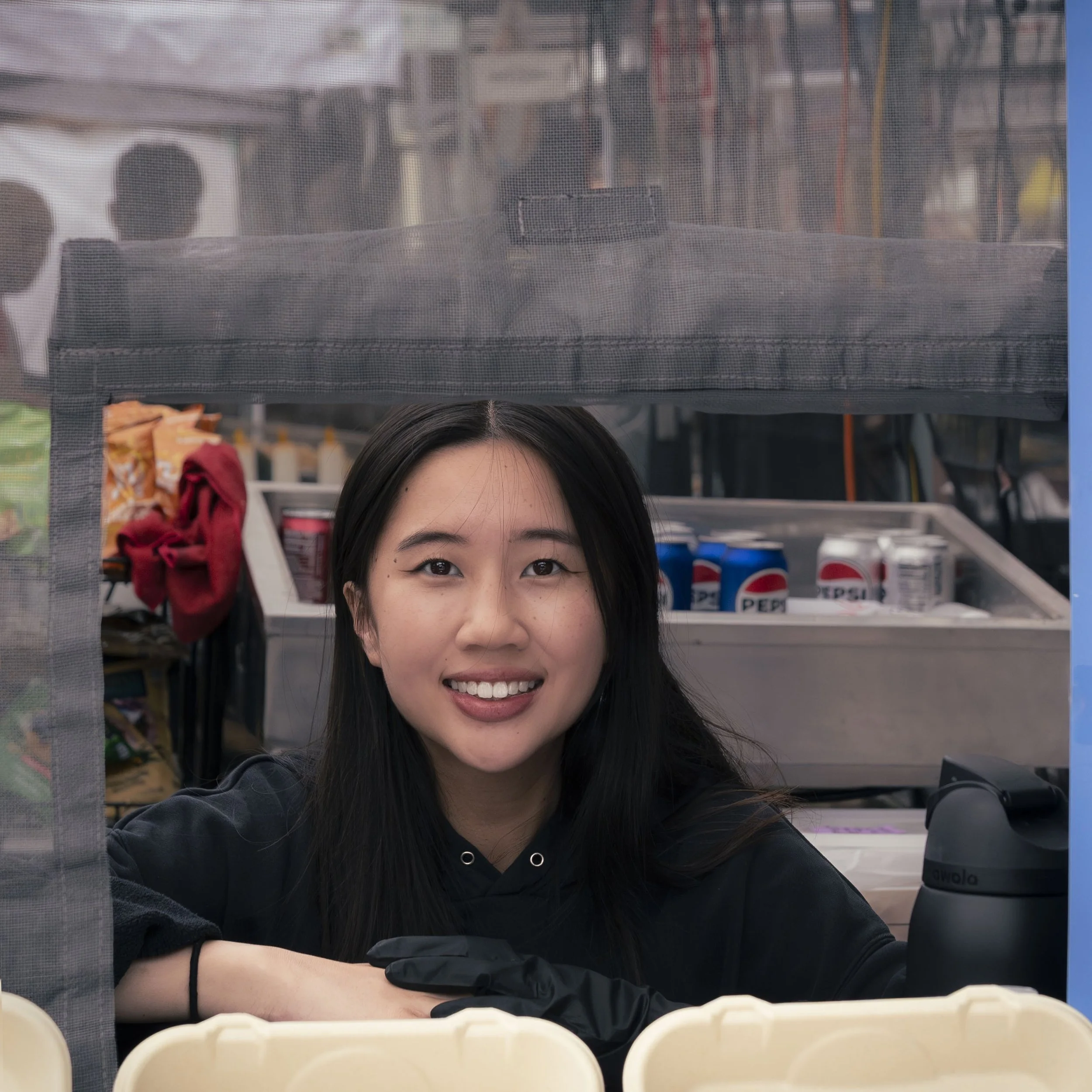 Cookie Proper team member, Jackie serving customers at the Alameda Wine and Art Festival