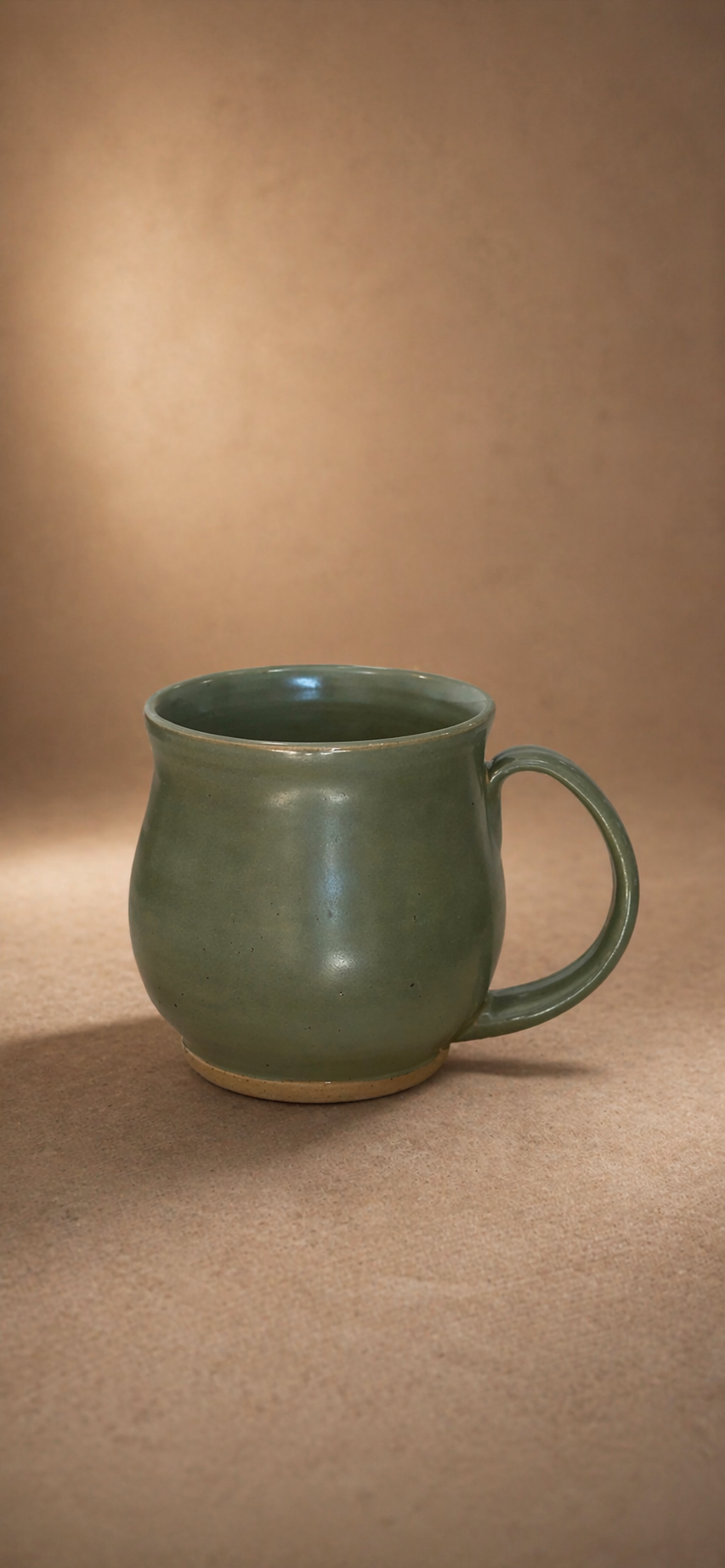 A green ceramic mug 