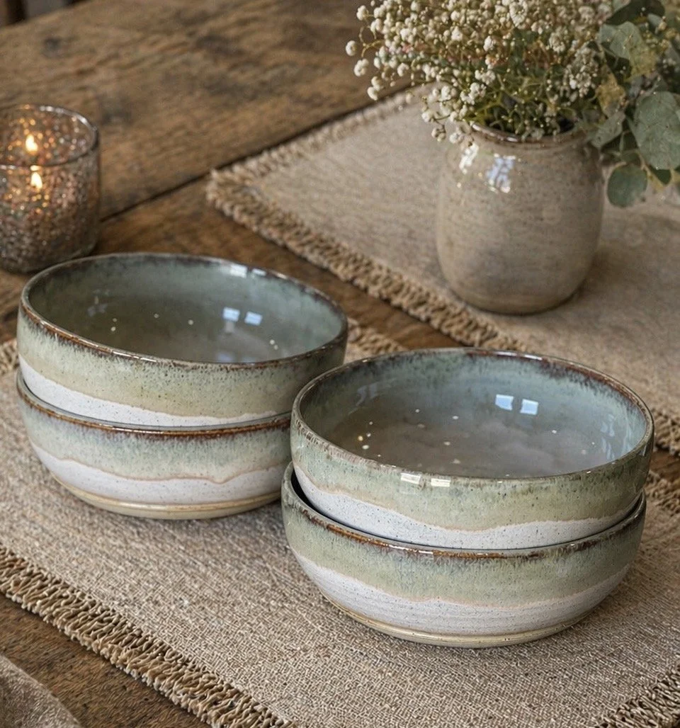 four stacked ceramic bowls..