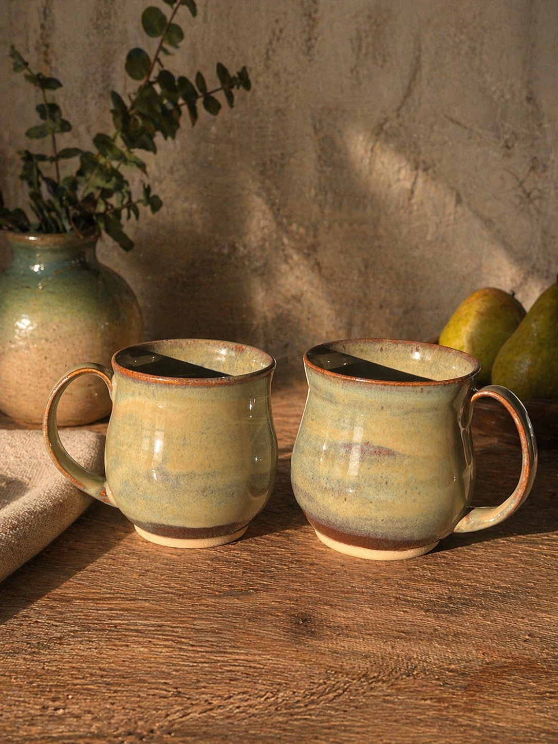 Two ceramic mugs with a gradient glaze.