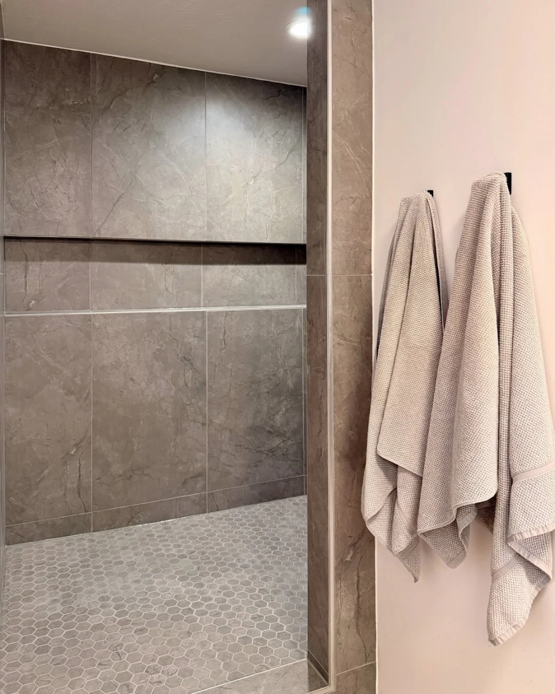 We&rsquo;ve been busy tiling lately and we thought we&rsquo;d share some recommendations for how to select the right tile type for your space!

The old shower tile was a lower cost glazed ceramic. While ceramic subway tiles and glazed ceramic penny r