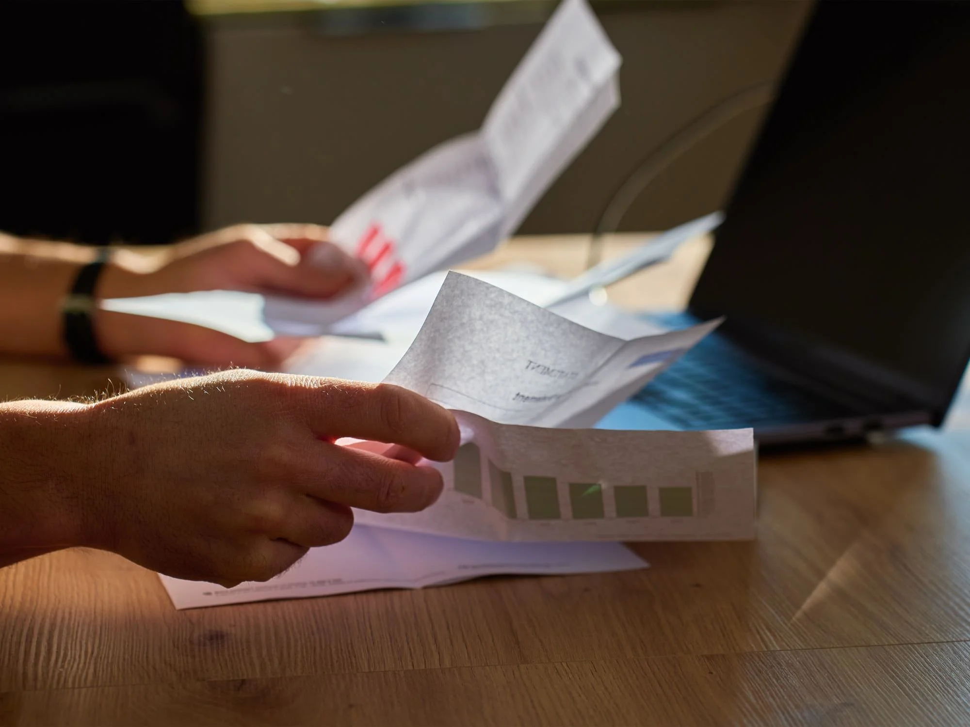 someone looking at financial statements - QRDO divorce