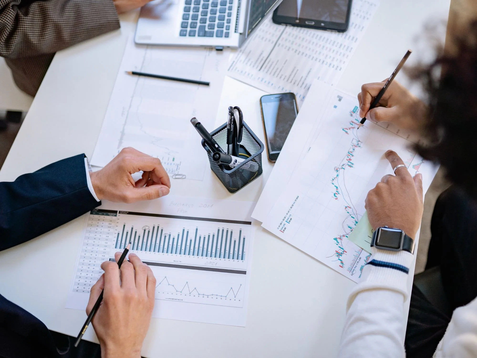 People pouring over financial statements