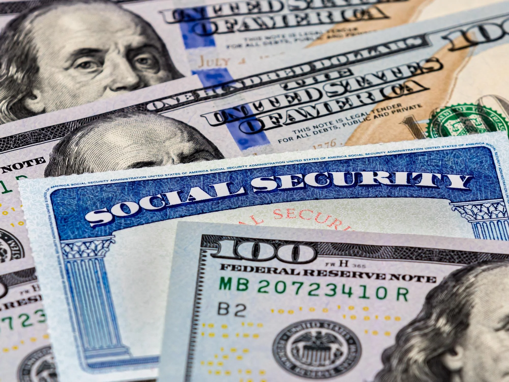 money and social security cards - Divorced Spouse Social Security Benefits