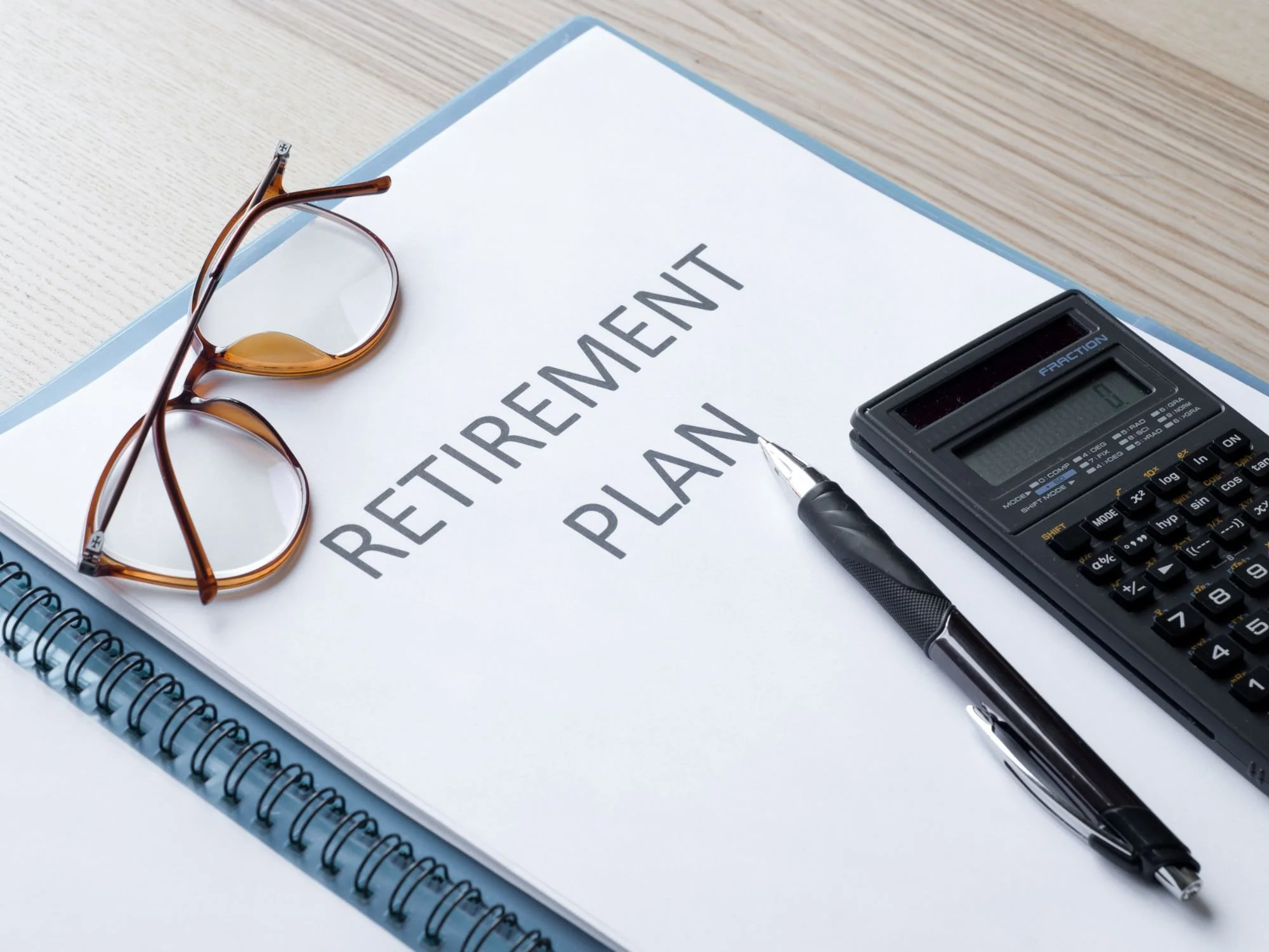 retirement plan booklet, pen and calculator - 401k divorce