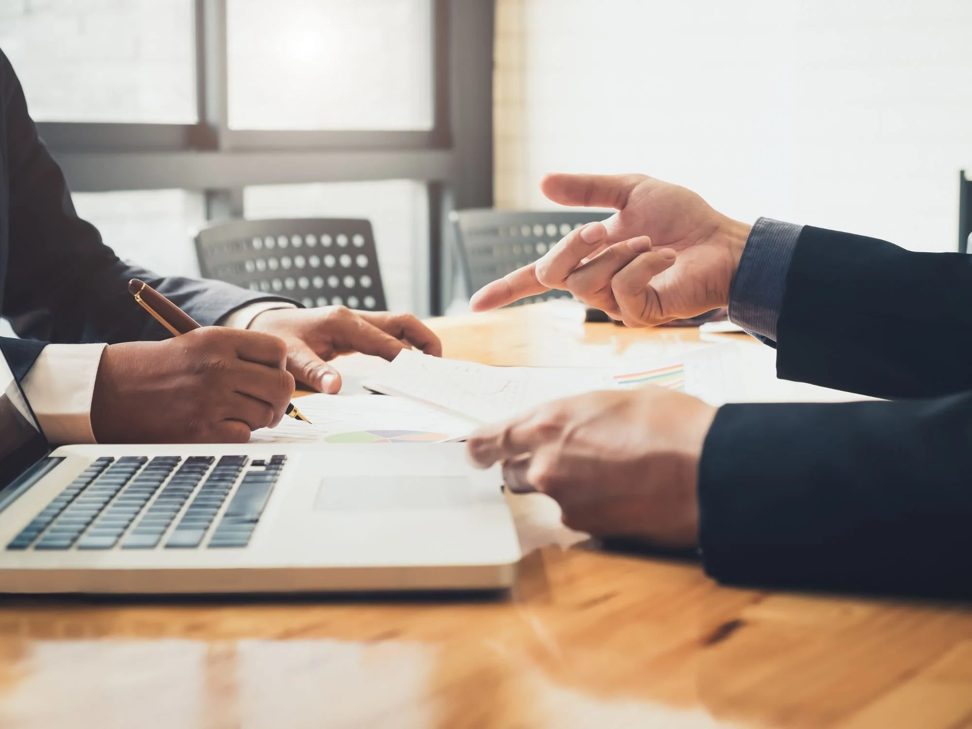 Two people's hands looking like they're working together