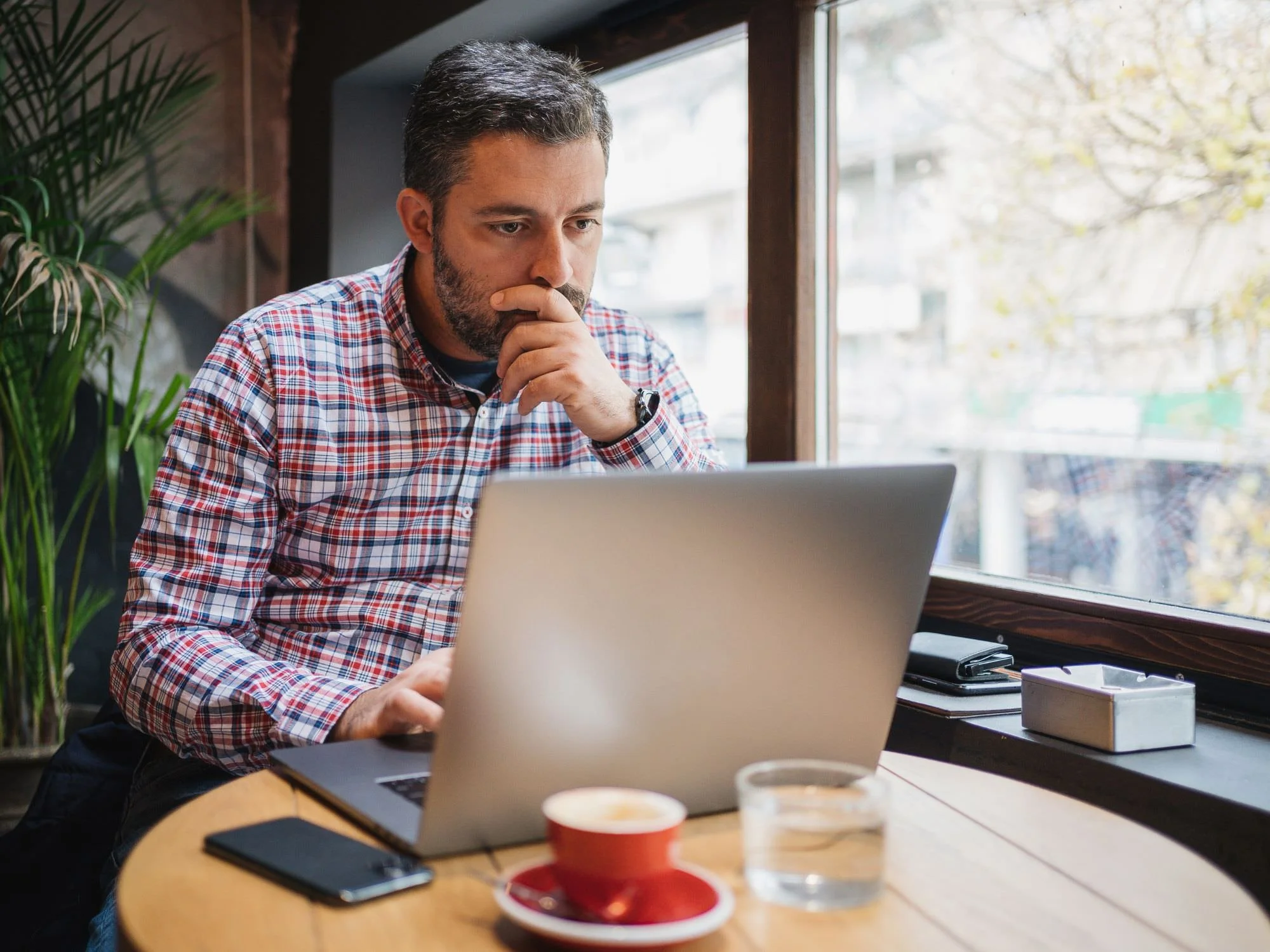 man sitting at his computer working - Financial Planning for Atlanta Business Owners