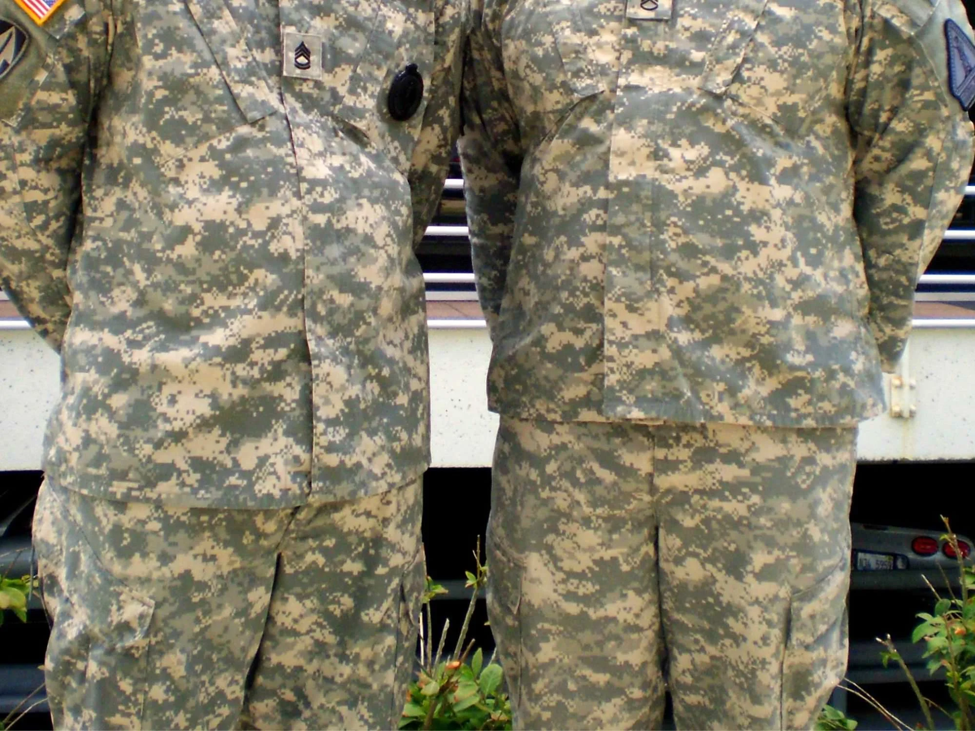 Two people in military fatigues