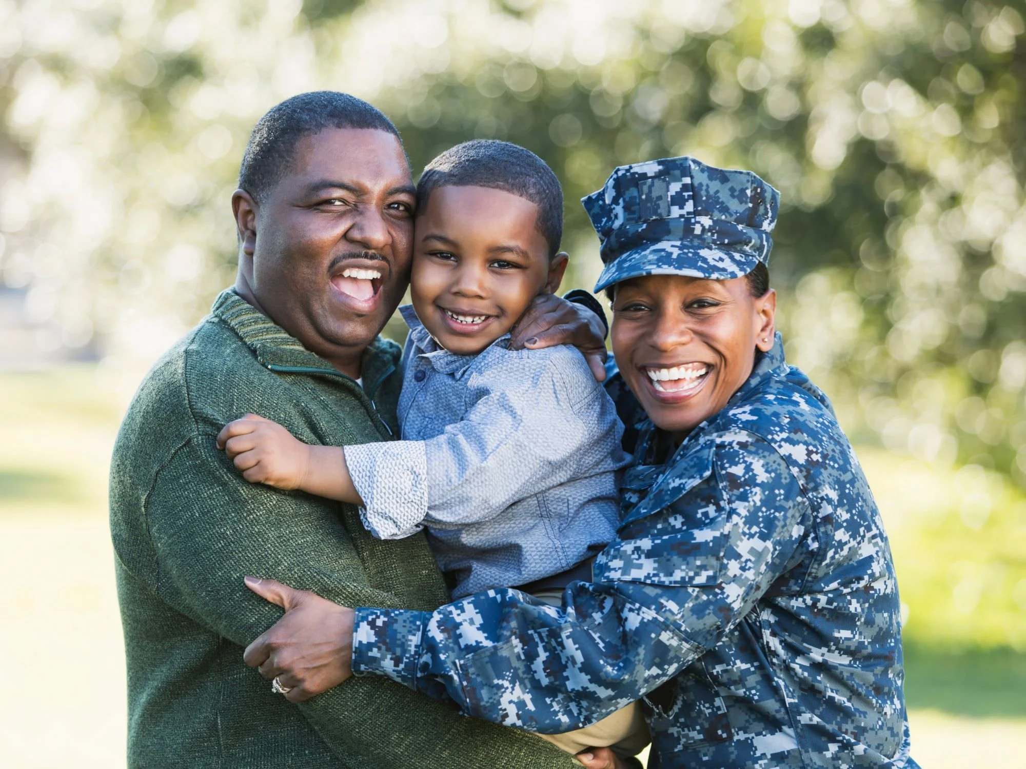 Wife in fatigues, dad and son smiling - Military Pension Divorce