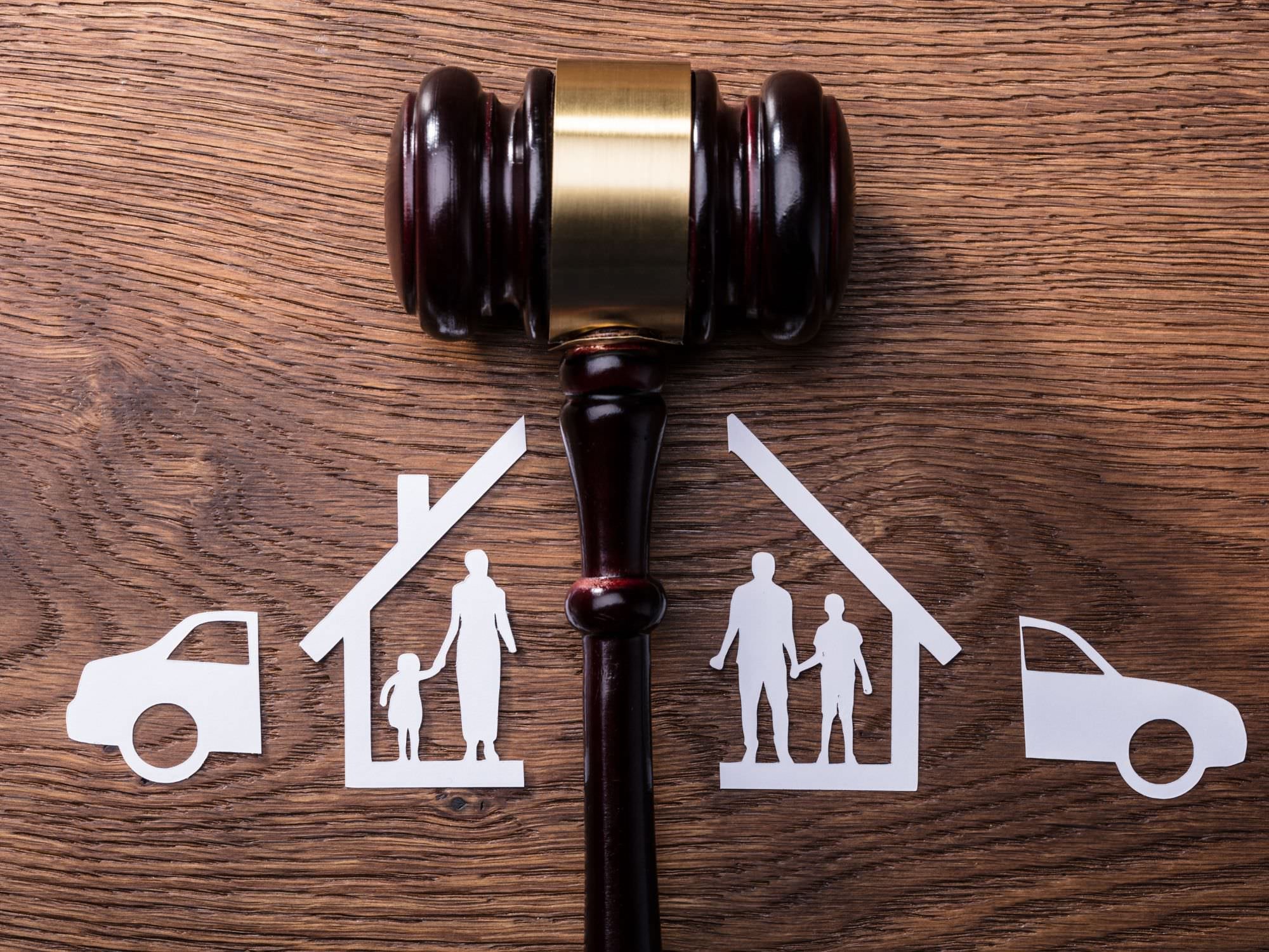 Out of a house and family cut in half with a gavel in the middle