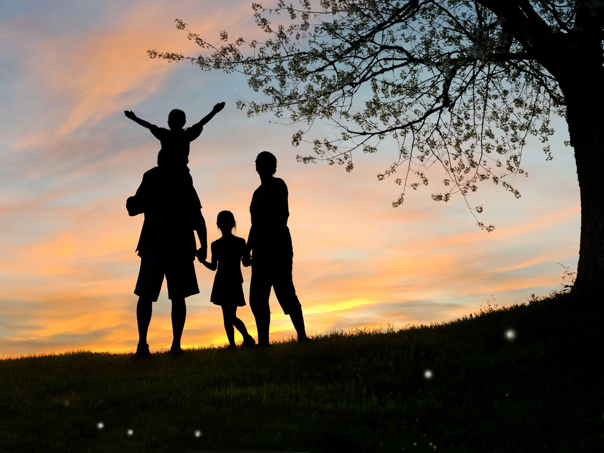 Family outside at dusk.