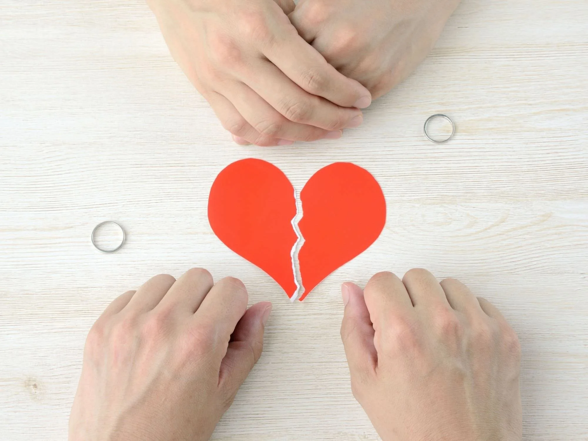 hands with a torn paper heart - gray divorce Atlanta, GA
