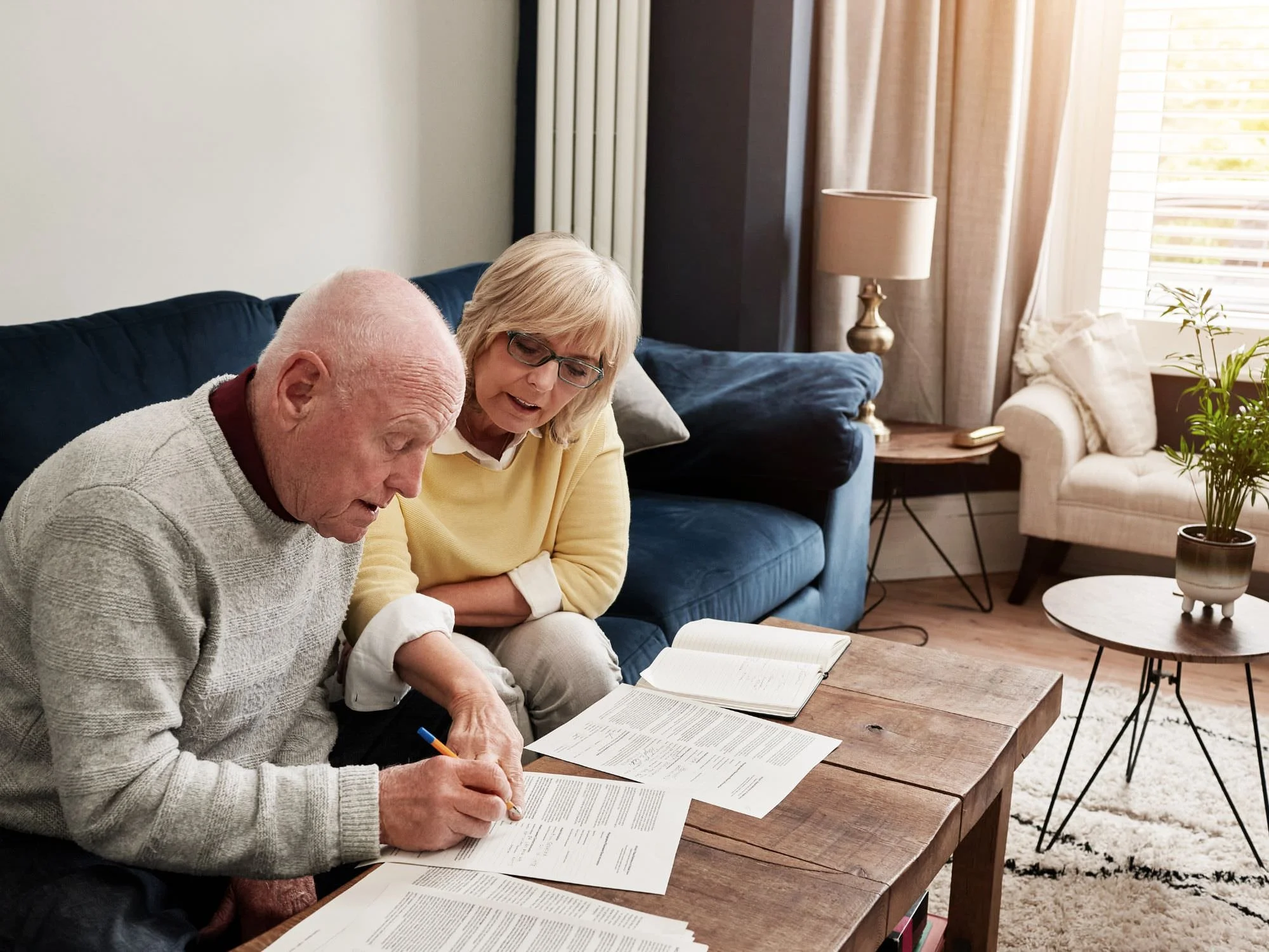 older couple filling out paperwork
