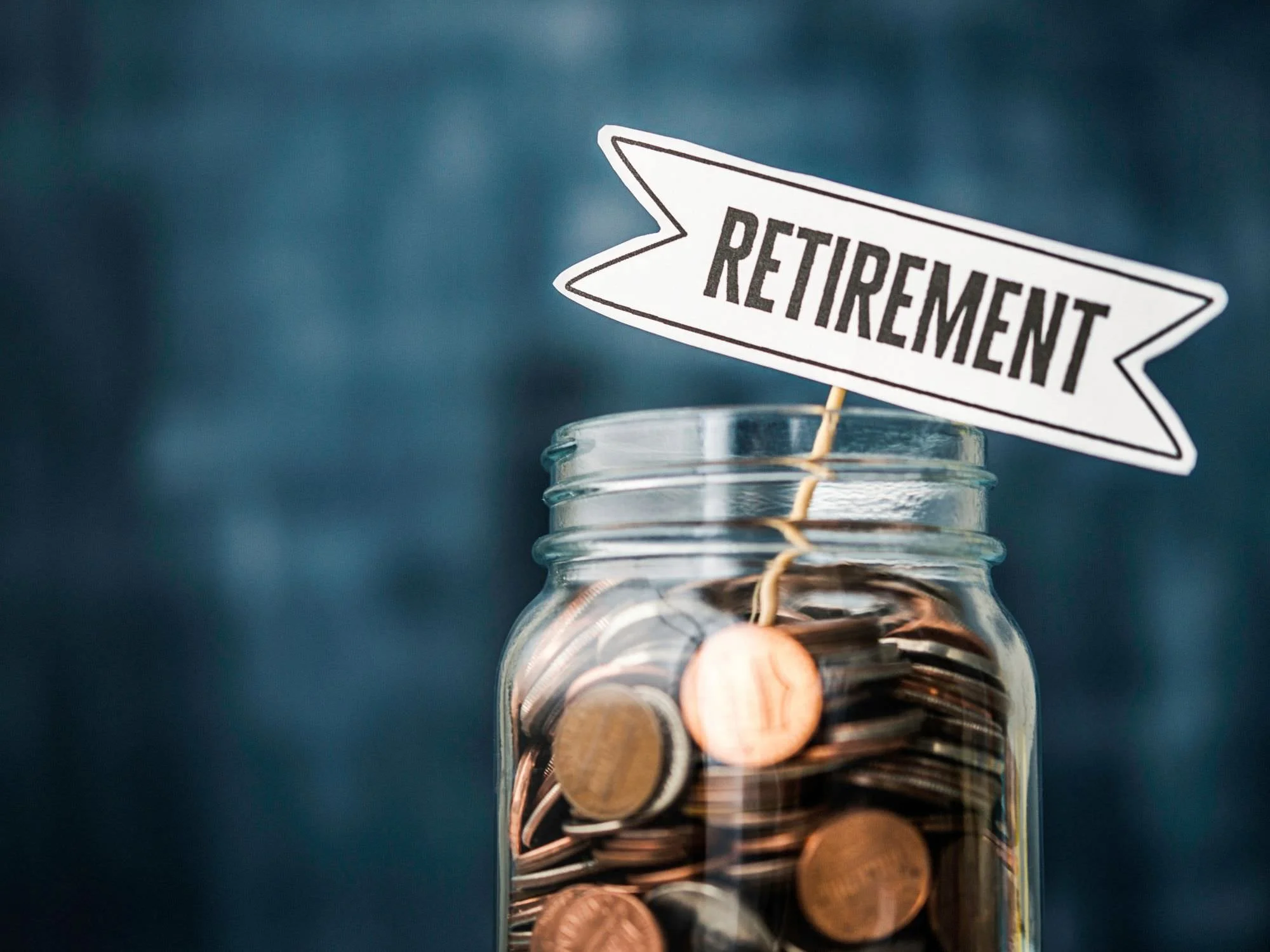 the words retirement written out and on a jar full of coins - QRDO divorce