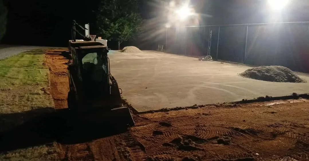 Some times you work at night. Building up a hill. This will be the expansion on an old tennis court.