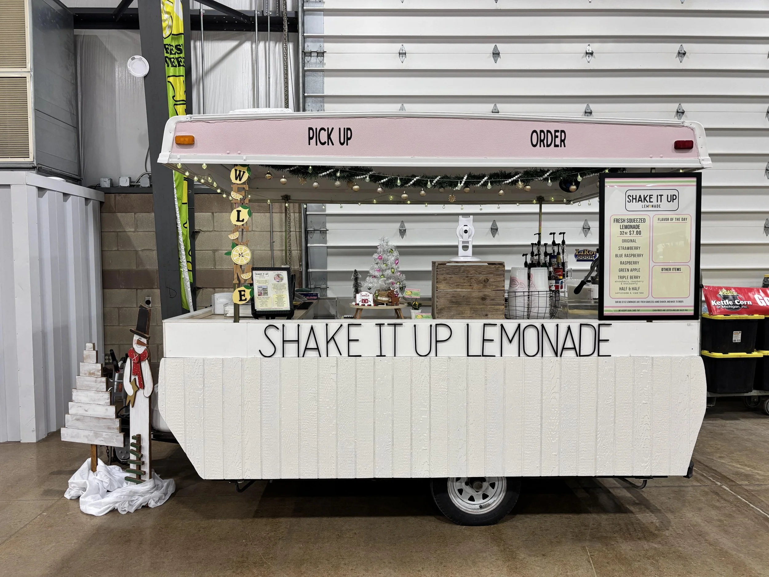 Shake It Up Lemonade mobile drink trailer serving various lemonade flavors at Vintage Market LLC White Christmas event in Monroe, Michigan
