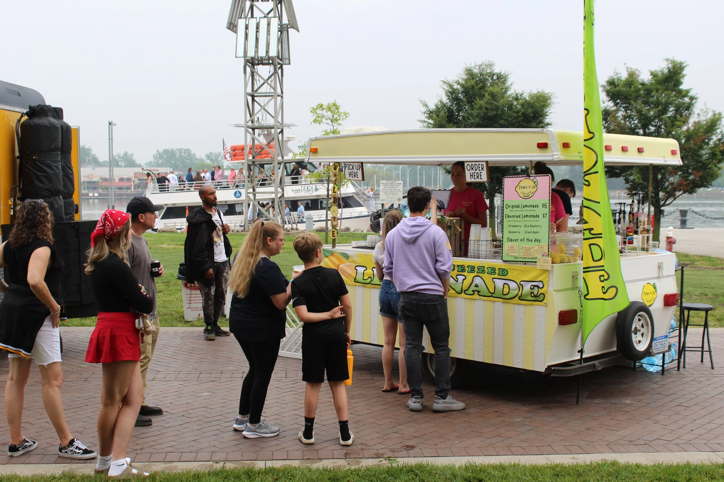 Shake It Up Lemonade mobile drink trailer with customers at Promenade Park in Toledo, Ohio