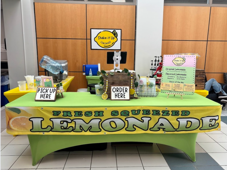 Shake It Up Lemonade tent set up serving fresh squeezed lemonade at VEX Robotics competition in Monroe, Michigan