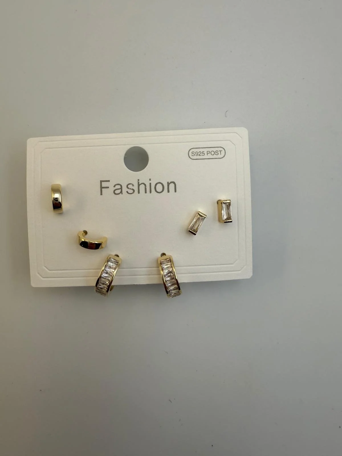 Set of six gold and silver fashion earrings with rhinestones displayed on a white card labeled 'Fashion'.