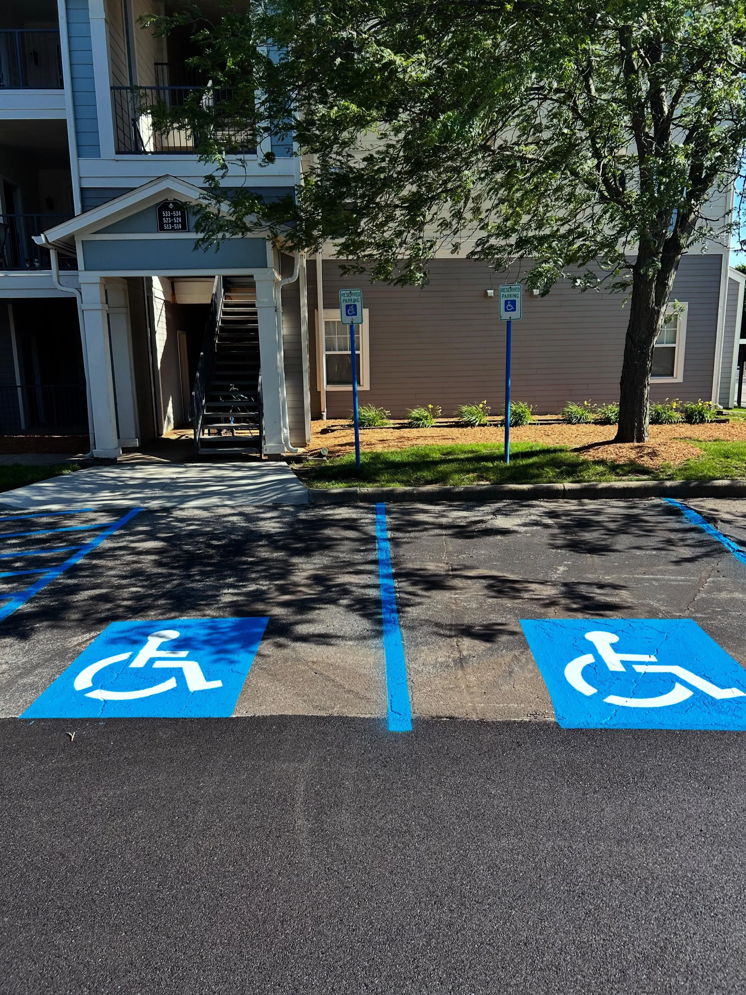 An apartment complex in Lafeyette, Indiana with fresh ADA parking stall lines by Blacktop Boss. 