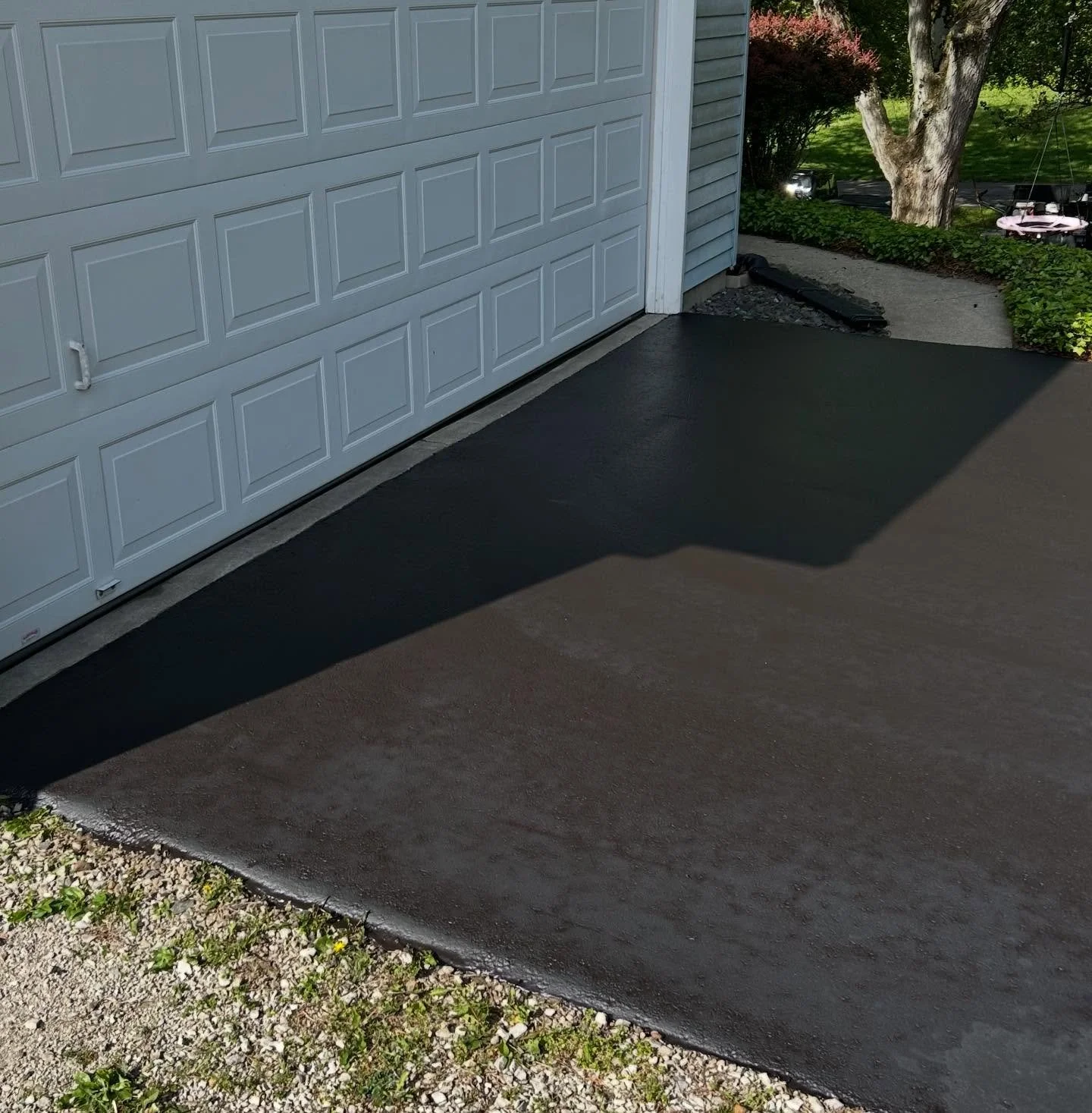 This driveway in Columbus, Indiana got their cracks filled and a fresh sealcoat by Blacktop Boss. 